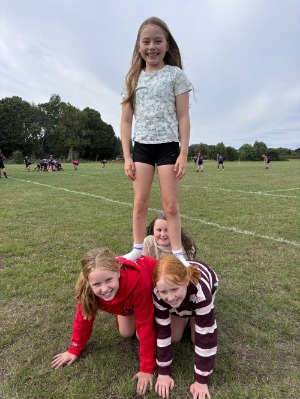 Kids making human pyramid at season opener 6 Sep